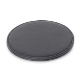 Round black coaster on a white background