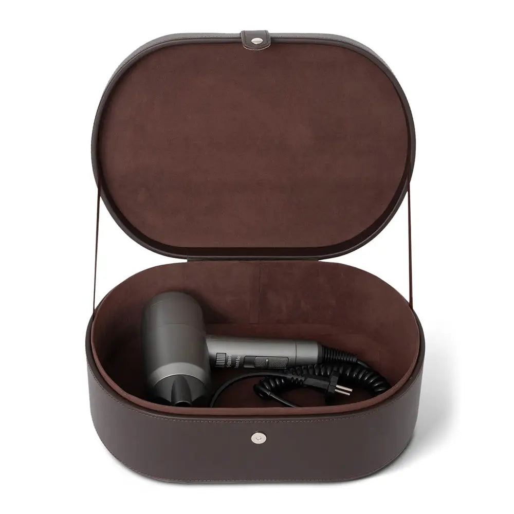 Brown leather-effect travel case with a hair dryer inside on a white background