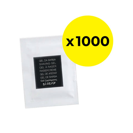 White shaving gel sachet with black box on the front displaying 'Shaving Gel' in Portuguese, English, French, German, Spanish, Romanian, Greek and Arabic. Yellow circle with black writing that says 'x 1000'. 
