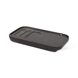 Black tray with grooves on a white background