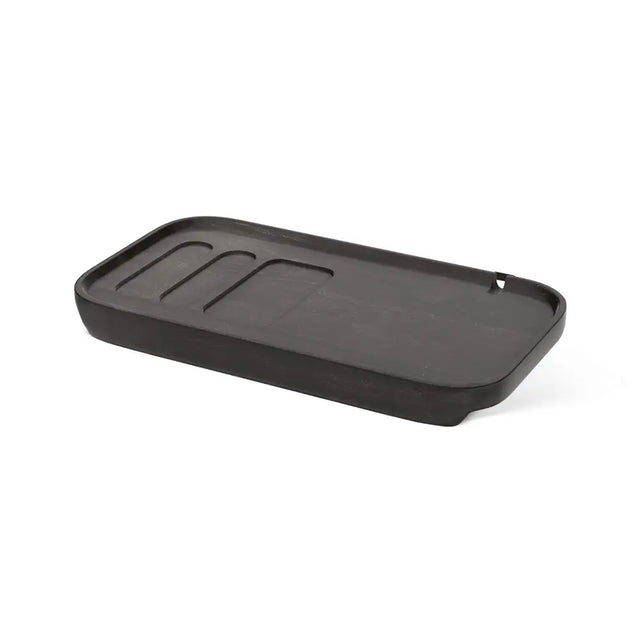 Black tray with grooves on a white background