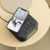 Black digital clock with wireless charging pad