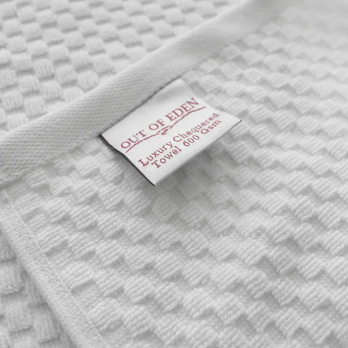 Out of Eden Luxury Chequered Cotton Face Cloth 600gsm, close-up showing chequered weave and label