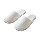 Pair of white slippers on a white background