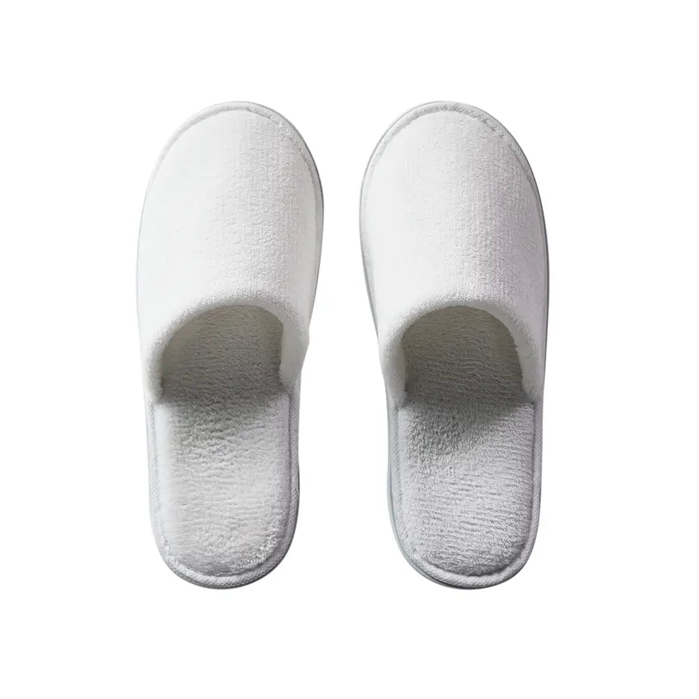 Pair of white slippers on a white background