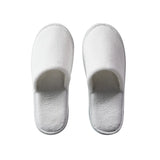 Pair of white slippers on a white background