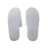 Pair of white slippers' soles on a white background