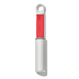 White lint remover with red roller on a white background