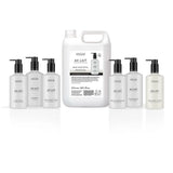 A 5 litre container of Au Lait Hand Wash Refill surrounded by six individual bottles Au Lait products on a clean white background.