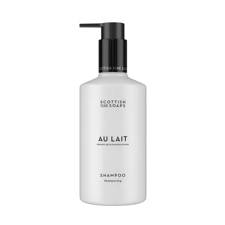 A 300ml bottle of Scottish Fine Soaps 'Au Lait' shampoo, featuring a matte white bottle and a black pump dispenser, centered on a plain white background.