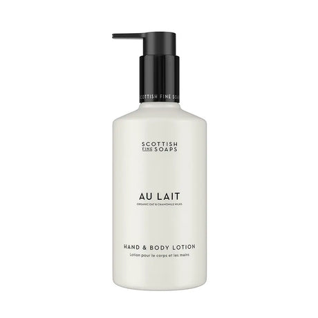 A bottle of Scottish Fine Soaps 'Au Lait' hand and body lotion, featuring a matte white bottle and a black pump dispenser, set against a plain white background.