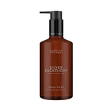 A bottle of Scottish Fine Soaps Silver Buckthorn Hand Wash, featuring an amber brown translucent bottle with a black pump dispenser, set against a plain white background.