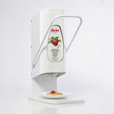 Darbo jam dispenser with lever, shown dispensing onto a pancake