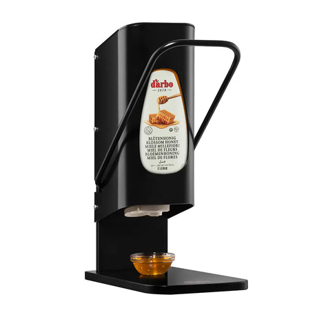 Darbo honey dispenser with lever, black stand, shown dispensing into a small bowl