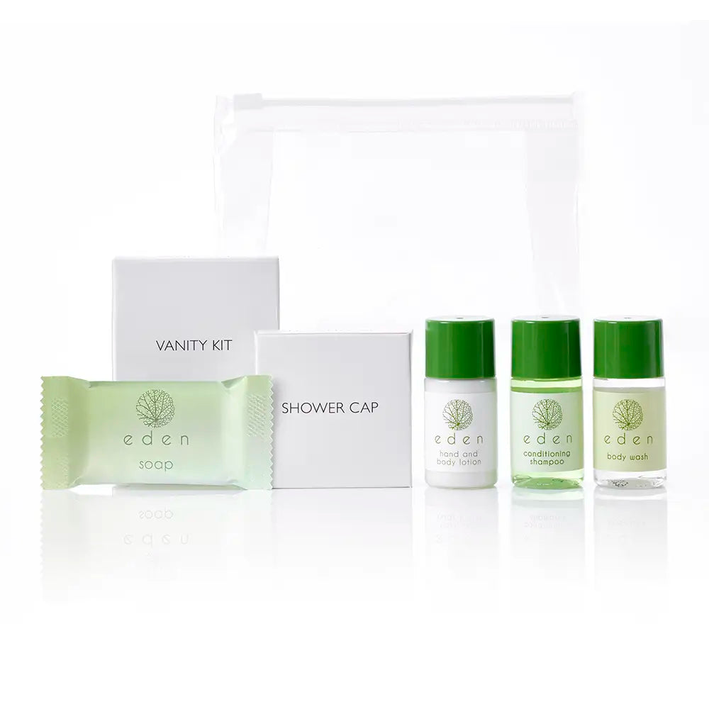 Welcome pack with shower cap, soap, and body wash bottles featuring 'eden' branding on a white background.