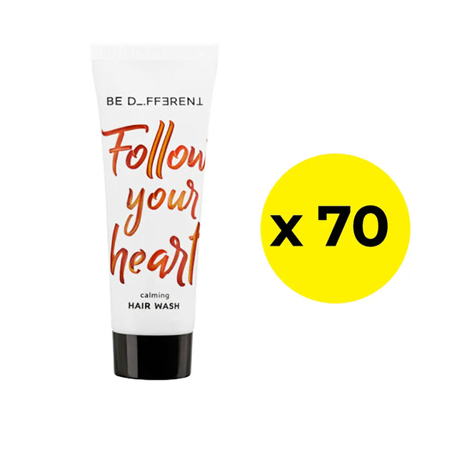 Hair wash tube with 'Follow your heart' text on a white background