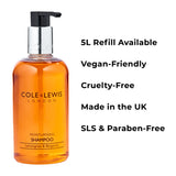 Orange shampoo bottle with Cole & Lewis branding on a white background, featuring text about product attributes.