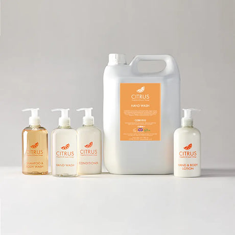 Set of Citrus brand skincare products including bottles and refil container on a light gray background