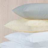Image featuring Easy-care Percale Oxford Pillowcase - Pair - White, beige and Ivory pillows in a pile