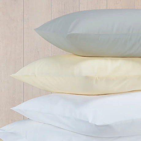 Image featuring Easy-care Percale Oxford Pillowcase - Pair - White, beige and Ivory pillows in a pile