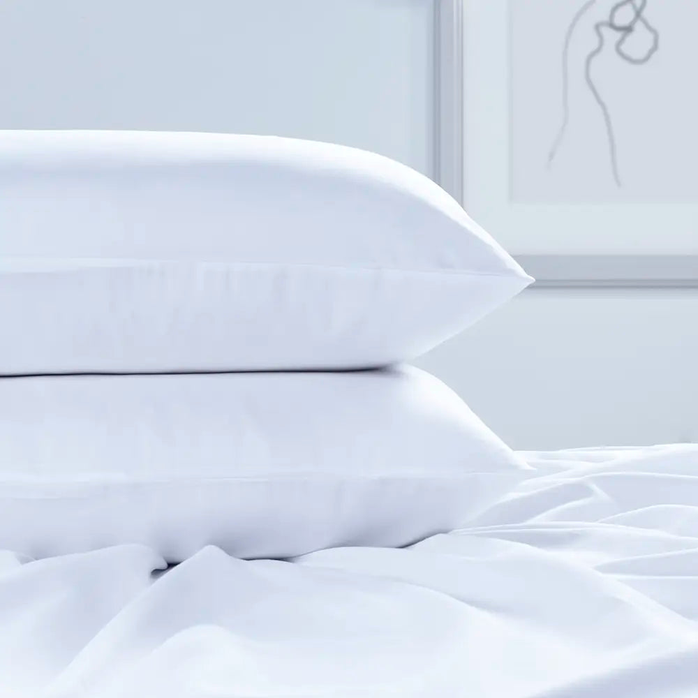 Luxury Egyptian Cotton 300 Thread Count Housewife Pillowcase on a bed in a bedroom setting