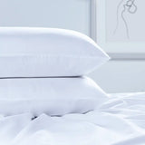 Luxury Egyptian Cotton 300 Thread Count Housewife Pillowcase on a bed in a bedroom setting