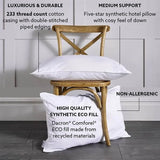 Luxury Just Like Down Eco Pillow - White pillows on a wooden chair against a gray paneled wall.
