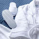 Terry Slipper with Non-Slip EVA Sole Open Toe in lifestyle setting with towel robe
