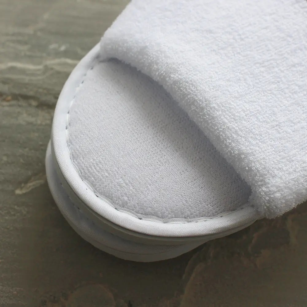 Stich detail of terry towelling slippers