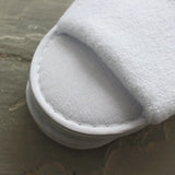 Stich detail of terry towelling slippers