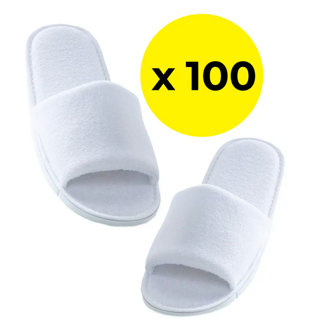 Pair of white slippers with a yellow circle displaying 'x 100' on a white background