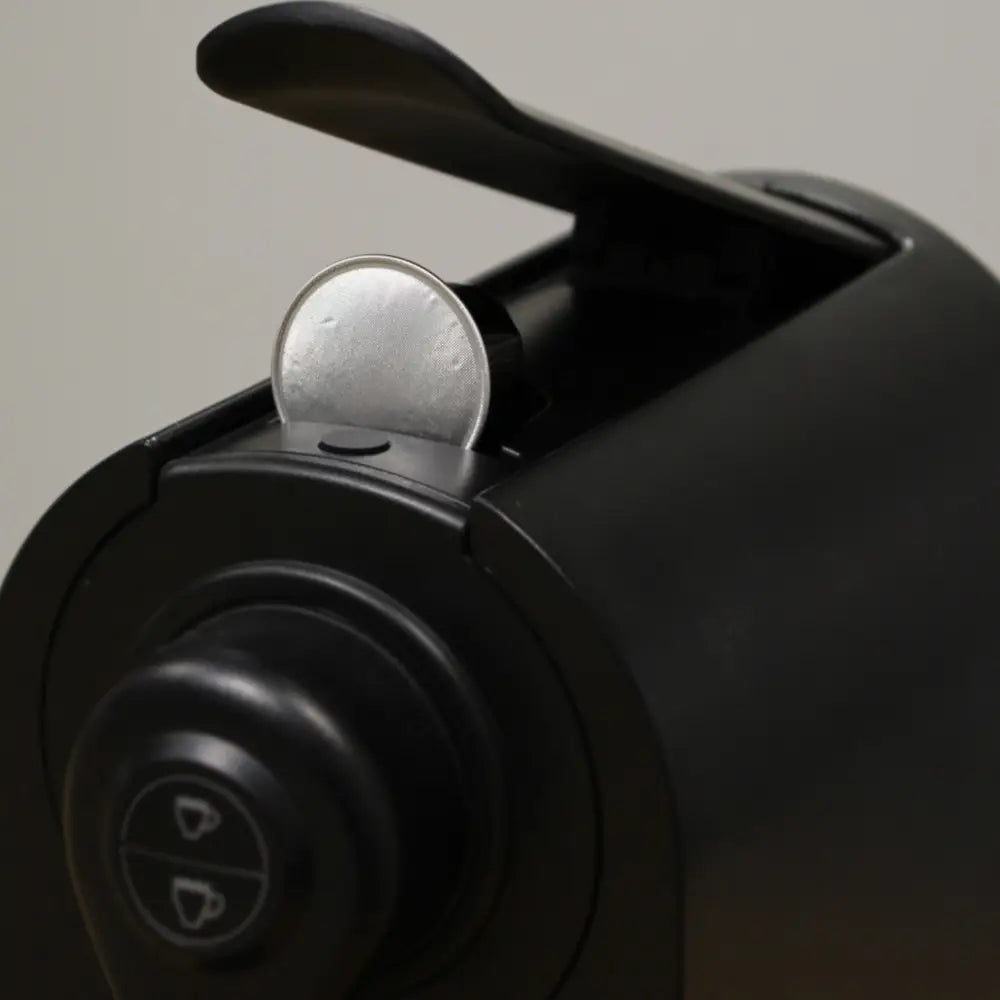 Close up of coffee pod in use in machine 