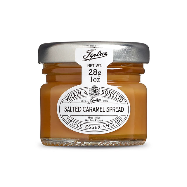 Jar of salted caramel spread with Tiptree label on a white background