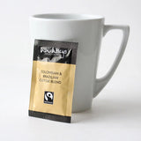 Wheatleys coffee blend package next to a white mug on a light background