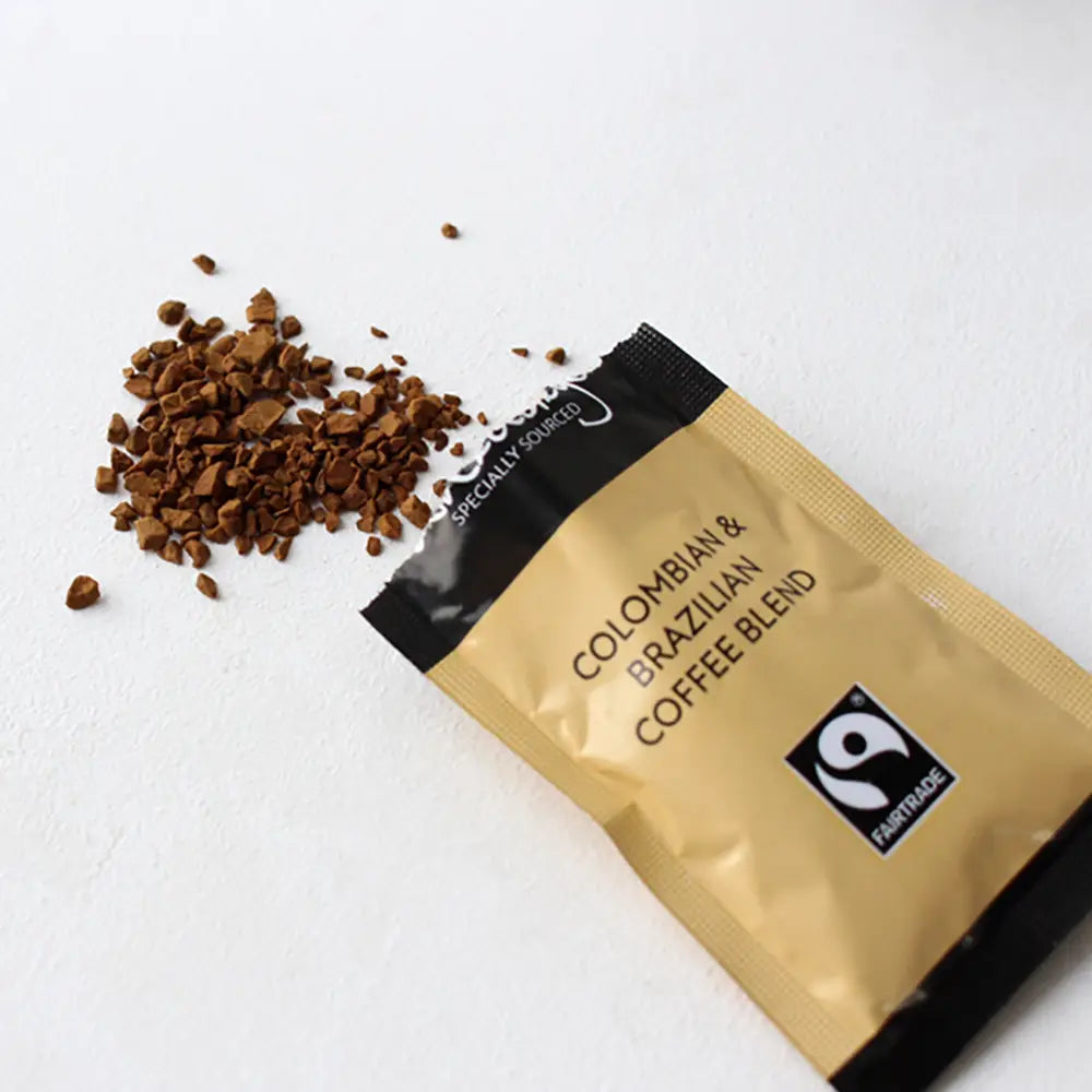 Coffee package with 'Colombian & Brazilian Coffee Blend' text and Fairtrade logo on a white background