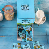 Box of Dorset Tea on a blue wooden surface