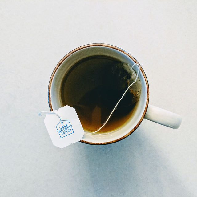 Lake district tea bag in mug with hot water 