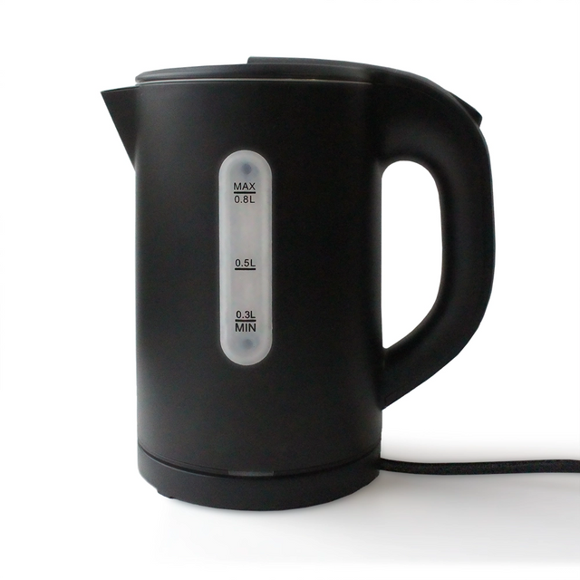 Black electric kettle with measurement markings on a white background