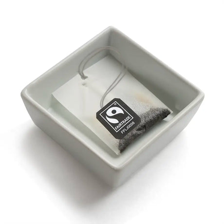 Porcelain Square Dish with used tea bag inside 