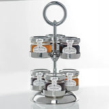 Silver three-tiered jam stand with jars of jam, orange marmalade, raspberry jam