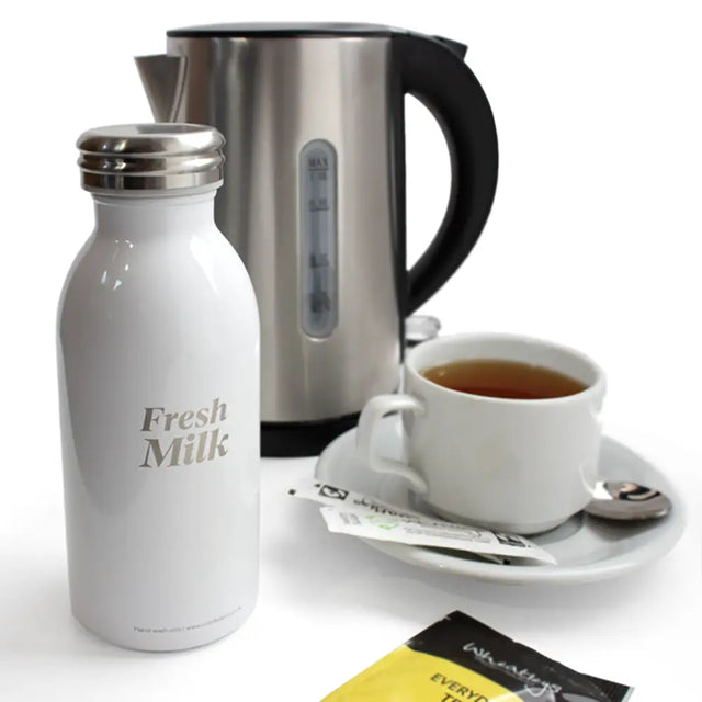  insulated white milk bottle in lifestyle setting