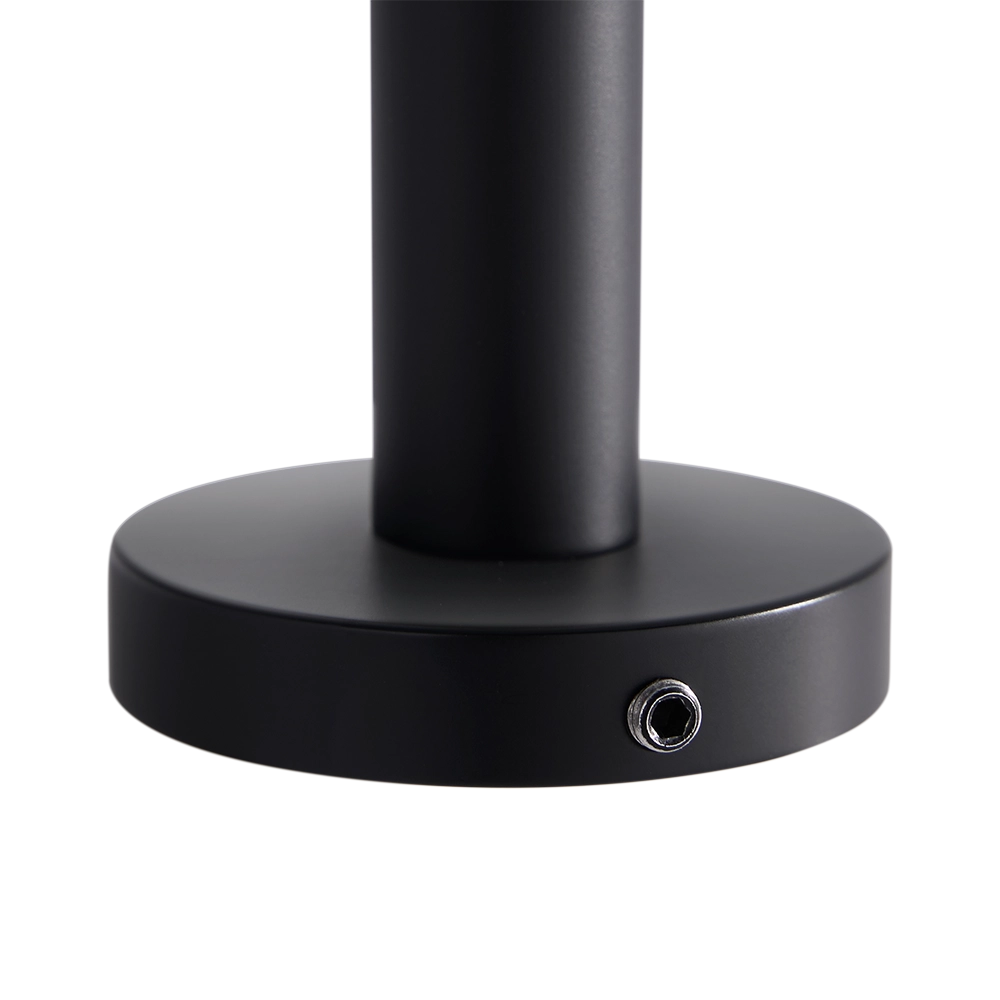 Black toilet roll holder fitting on a white background