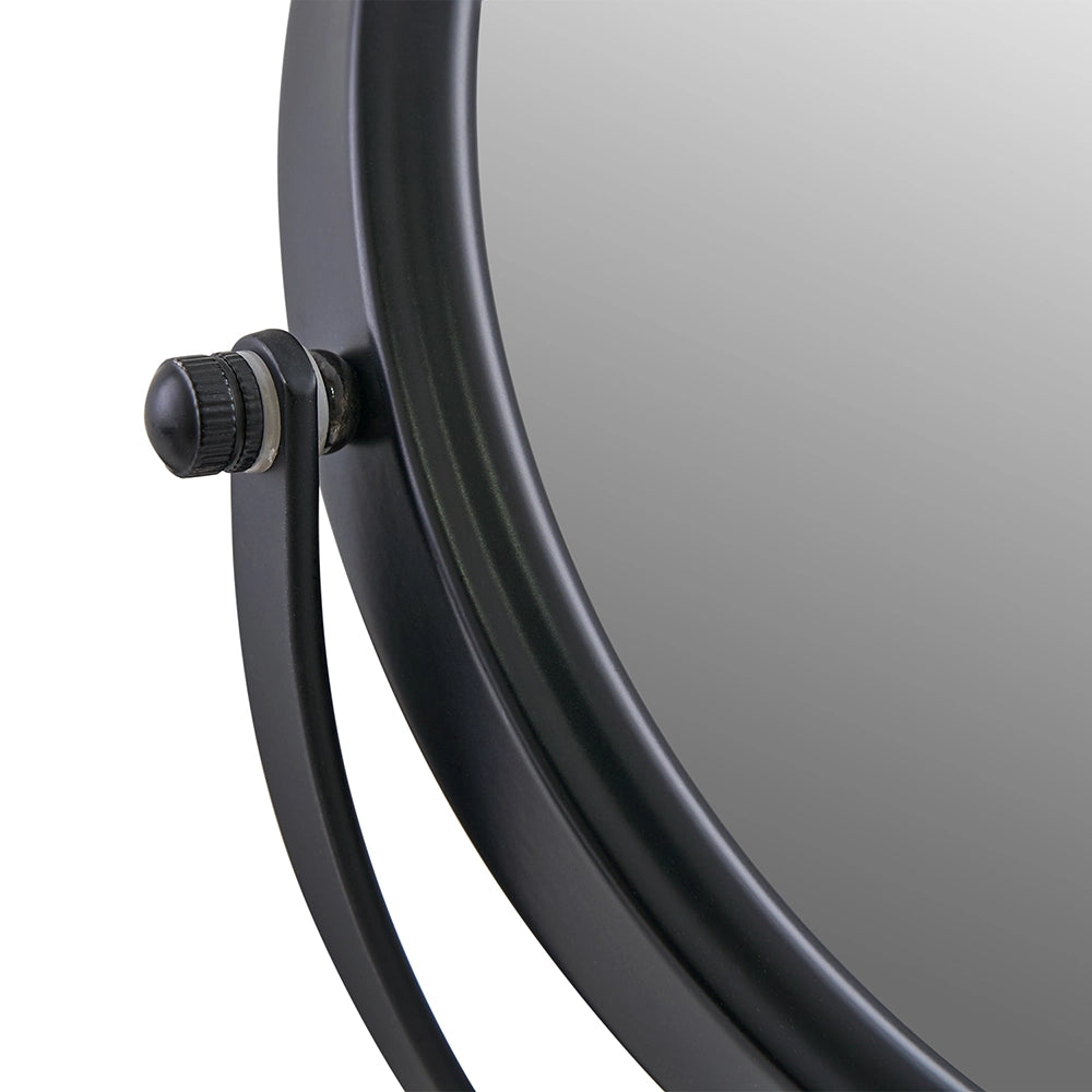 Black-framed round mirror on a white background