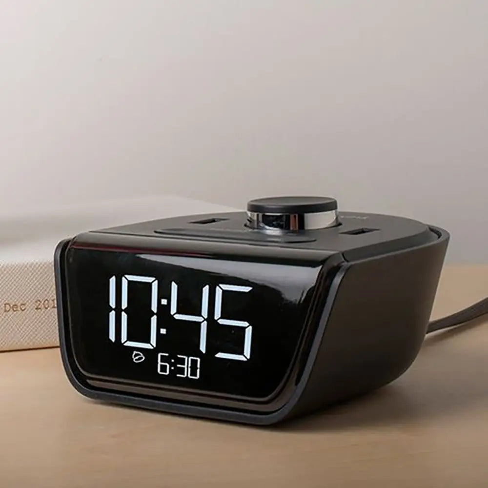 Cubie Wink Hotel Alarm Clock & Charger clock on a beige surface with a light gray background