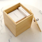 Wooden Bamboo Cube Container displaying products that can be stored in item