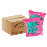 Two pink 'Mini Pop!' popcorn bags in front of a cardboard box labeled 'Popcorn Shed'.