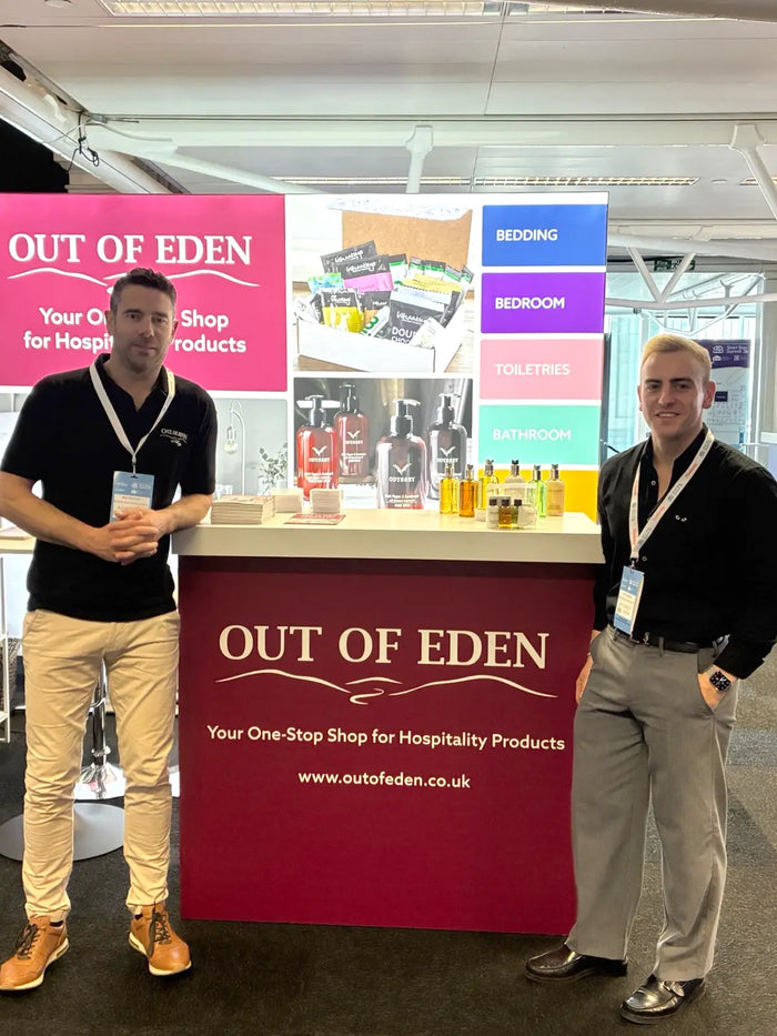 Out of Eden team at trade show stand promoting bedding, bedroom, toiletries and bathroom hospitality products