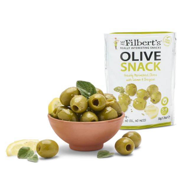 A bowl of Mr. Filbert's Lemon and Oregano Green Olives, garnished with fresh lemon slices and oregano, illustrating a serving suggestion.